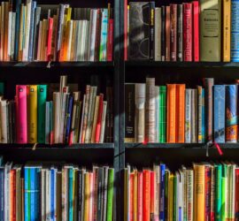 books in black wooden book shelf