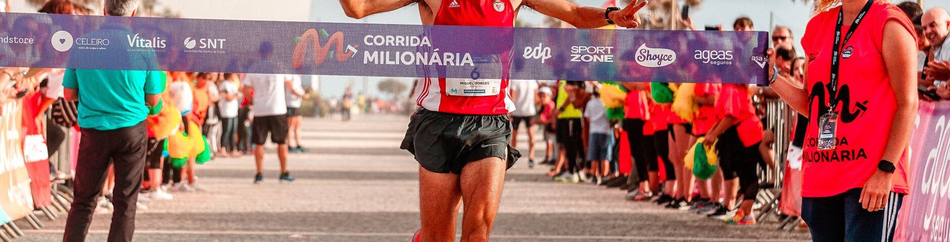 man running on paved road