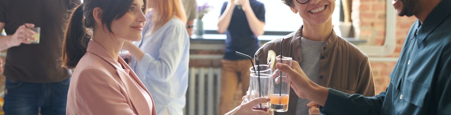 photo of people holding glasses