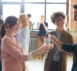 photo of people holding glasses