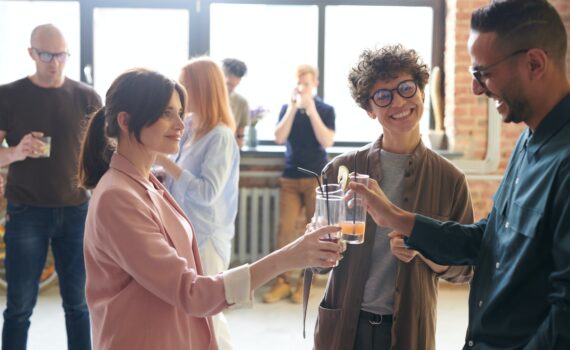 photo of people holding glasses