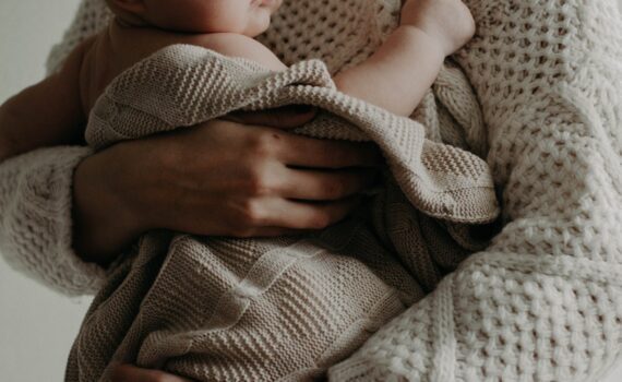 woman carrying a baby