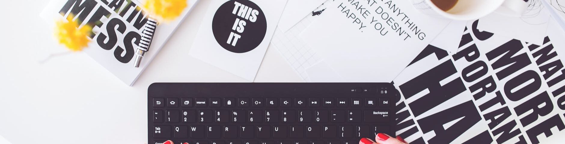girl writing on a black keyboard