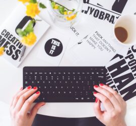 girl writing on a black keyboard