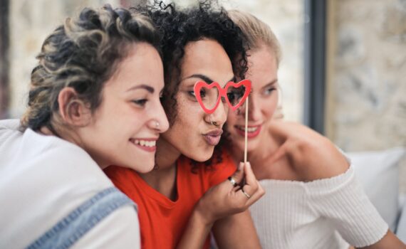 three women posing for photo