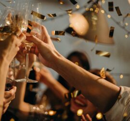 people toasting wine glasses