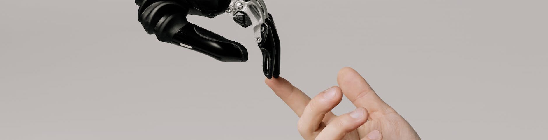 bionic hand and human hand finger pointing