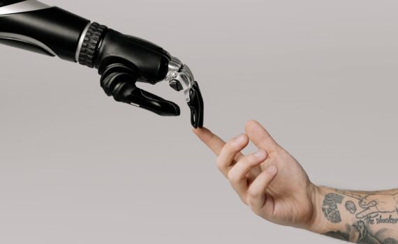 bionic hand and human hand finger pointing